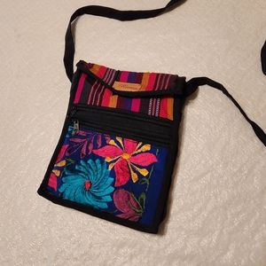 Roatan cross body bag. Multi colored striped floral